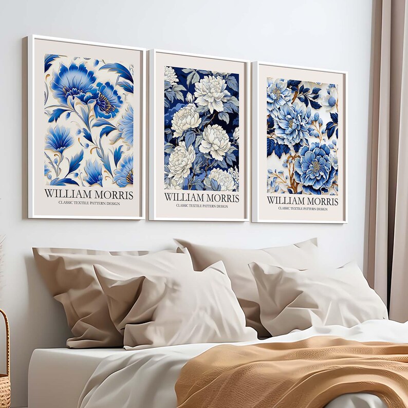 May include: Three framed prints with a white background and blue and white floral designs. The prints have the text "William Morris" and "Classic Textile Pattern Design" on them.