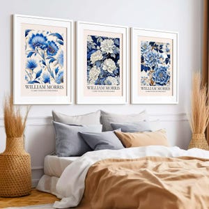 May include: Three framed prints with floral designs in shades of blue and white. Each print features the text "William Morris" and "Classic Textile Pattern Design".