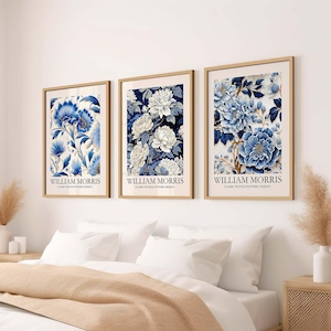 May include: Three framed prints featuring blue and white floral patterns. Each print has the text "William Morris" and "Classic Textile Pattern Design" below the image.