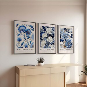 May include: Three framed prints of blue and white floral patterns with the text "William Morris Classic Textile Pattern Design" below each image.