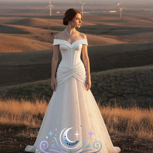 星のチュールと月のディテールが施されたオフショルダーの天体ウェディングドレス