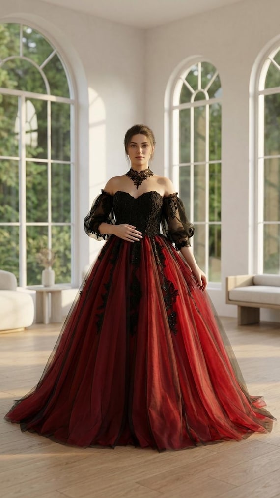 Opala: a bold Black & red gothic wedding gown with a sweetheart neckline, lace bodice, tulle sleeves, and a dramatic layered train Opala: a bold Black & red gothic wedding gown with a sweetheart neckline, lace bodice, tulle sleeves, and a dramatic layered train