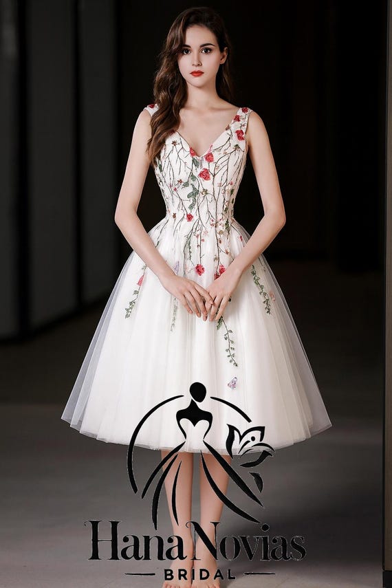 Calliope Wedding Dress - Knee-Length Gown with Intricate Floral Embroidery, V-Neckline, and Open Back for a Whimsical Bridal Look