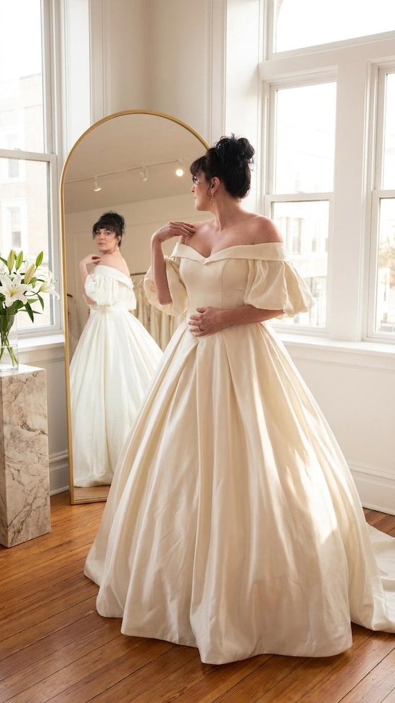 cream off the shoulder wedding dress Off-the-shoulder Satin Ball Gown With Puff Sleeves, Corset Back, and Cathedral Train – Classic Bridal Gown for a Regal Look subcat_Sleeveless-Dresses See this plus Size:US 8 / UK 12 / EU 38 Camo Bridesmaid Dresses Shoulder sleeves