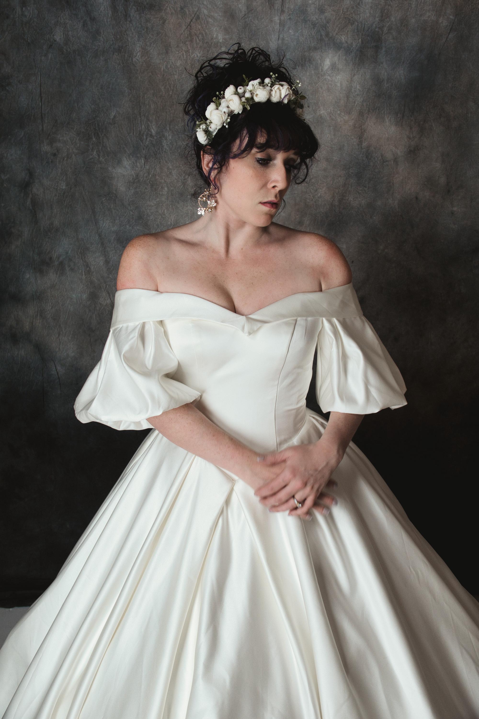 Off-the-Shoulder Satin Ball Gown Wedding Dress with Puff Sleeves, Corset Back, and cathedral Train – Classic Bridal Gown for a Regal Look