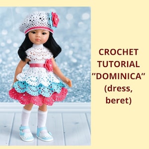 May include: A doll wearing a handmade crochet dress, beret, and shoes. The dress features white, blue, and red layers. The beret is white with a red and blue floral accent. The text on the right says "CROCHET TUTORIAL 'DOMINICA' (dress, beret)".