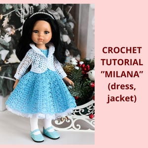 May include: A doll wearing a handmade blue crochet dress and a white crochet jacket. The dress has a full skirt and white lace trim. The doll also wears white tights and blue shoes. The text on the right says "CROCHET TUTORIAL 'MILANA' (dress, jacket)".