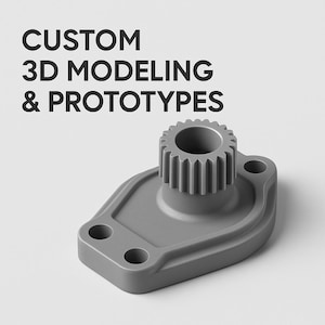 Puede incluir: Un componente prototipo gris impreso en 3D con una parte superior en forma de engranaje y una base con dos agujeros. El texto "CUSTOM 3D MODELING & PROTOTYPES" se muestra encima del componente.