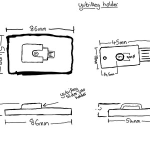 May include: A black and white technical line drawing of a Yubikey holder. The diagram displays top, side, and front views with dimensions in millimeters, including an 86mm by 54mm base and a 45mm by 18mm Yubikey with a 9mm diameter circular button.