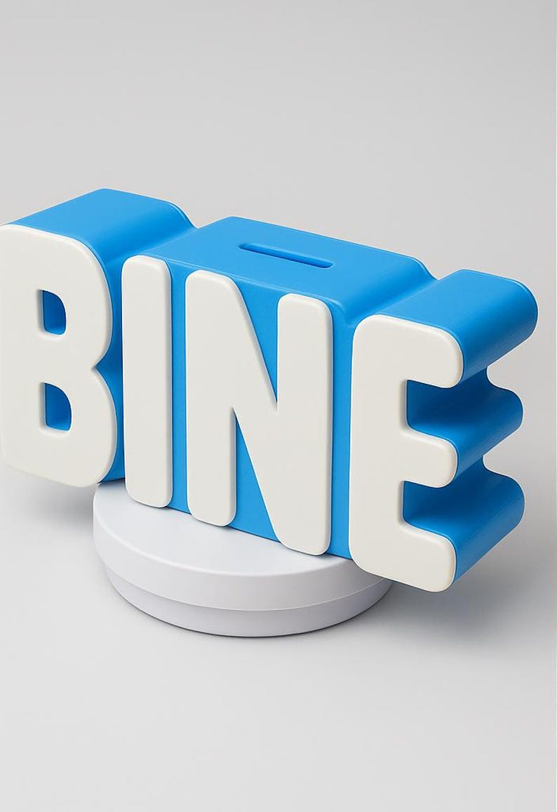 May include: A blue and white piggy bank in the shape of the word "BINE". The letters are white and stand out against the blue body of the bank. The bank has a slot on top for inserting money and sits on a white circular base.