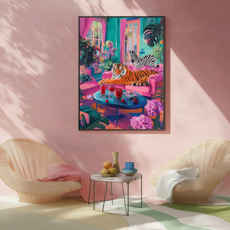 May include: A framed art print depicts a vibrant interior scene. A tiger lounges on a pink sofa, with a zebra nearby. A table holds drinks, surrounded by lush plants and flowers. The color palette includes pink, teal, and orange.