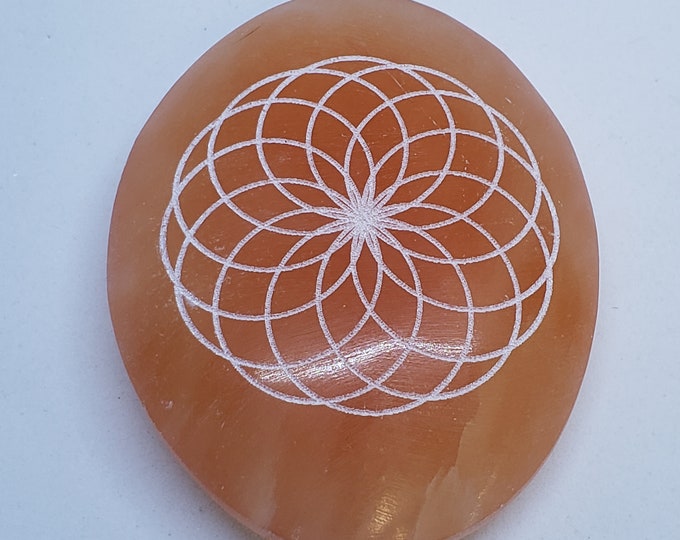 Selenite Palm Stone- laser etched Seed of Life design, red