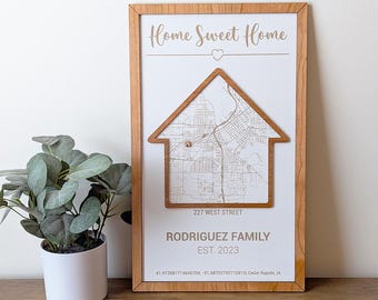 May include: A wooden sign with a house-shaped cutout, featuring a map of Cedar Rapids, Iowa. The sign reads "Home Sweet Home", "227 West Street", "Rodriguez Family", "Est. 2023", and coordinates for Cedar Rapids, Iowa.