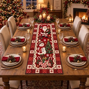 May include: A rectangular red Christmas table runner featuring a central design of Santa Claus, a snowman, a decorated pine tree, and wrapped gifts. The border is patterned with red and white stars and holly leaves, set on a wooden dining table.