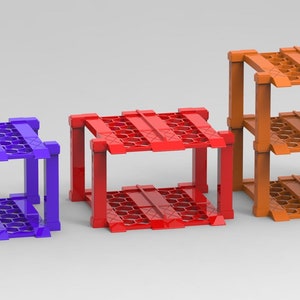 May include: Four different sized metal shelf units in green, purple, red, and orange. The shelves are made of a wire mesh design.