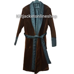 May include: A brown velvet robe with a teal quilted lining and trim. The robe has a matching belt and cuffs. The text "Kiltjacketonlineshop" is printed on the robe.