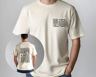 May include: A cream-coloured t-shirt with a distressed black and white American flag design. The flag design is on the front left chest and the back of the shirt. The flag's stars are replaced with a QR code.