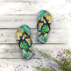 May include: A pair of flip-flops featuring a sea turtle design. The flip-flops have black straps and a vibrant pattern of blues, greens, and yellows. The design includes a detailed turtle illustration on a swirling background.