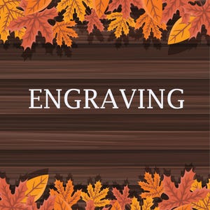 May include: The word "ENGRAVING" in white text is centred on a dark brown, wood-grain background. The top and bottom of the image are framed with orange, yellow, and brown autumn leaves.
