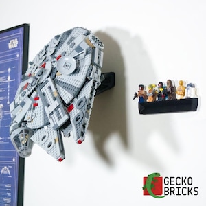 May include: A gray and white Lego Millennium Falcon model mounted on a black bracket. A black shelf holds several Lego Star Wars figures. The Gecko Bricks logo is in the bottom right corner.