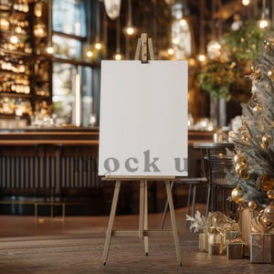 May include: A wooden easel with a blank white canvas, set in a restaurant or bar. The word "mock u" is faintly visible on the canvas. The background is blurred, with warm lighting and holiday decorations.