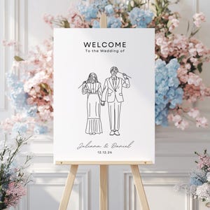 May include: A white welcome sign with black text and a line drawing of a couple. The text reads "Welcome to the Wedding of Juliana & Daniel 12.12.26".