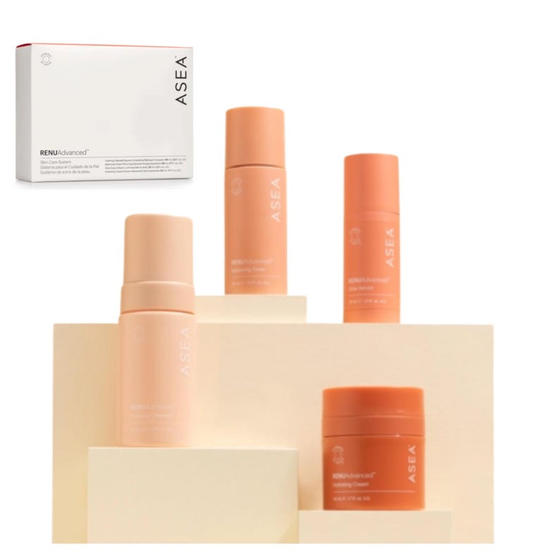 May include: A collection of skincare products in peach-colored containers, including a box labeled "RENUAdvanced" and several bottles and jars. The products are arranged on a tiered, off-white display, with the brand name "ASEA" visible on each item.