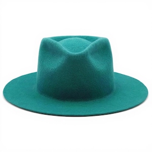 May include: A teal fedora hat with a wide brim. The hat has a classic teardrop crown and a grosgrain ribbon band. The hat is made of a felt material and is a solid color.