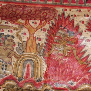 May include: A detailed, hand-painted illustration depicting a scene with figures, a tree, and flames. The artwork features a color palette of red, brown, and beige. The figures are adorned with intricate details, and the overall style suggests a traditional or cultural theme.
