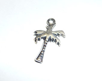 May include: A silver palm tree charm with a loop at the top for attaching to a necklace or bracelet.