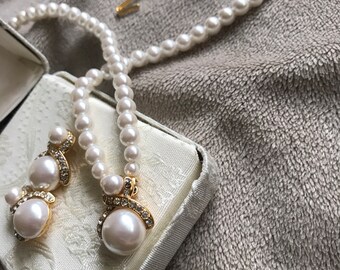 Gold,crystal and white faux glass Pearl necklace and earrings set.