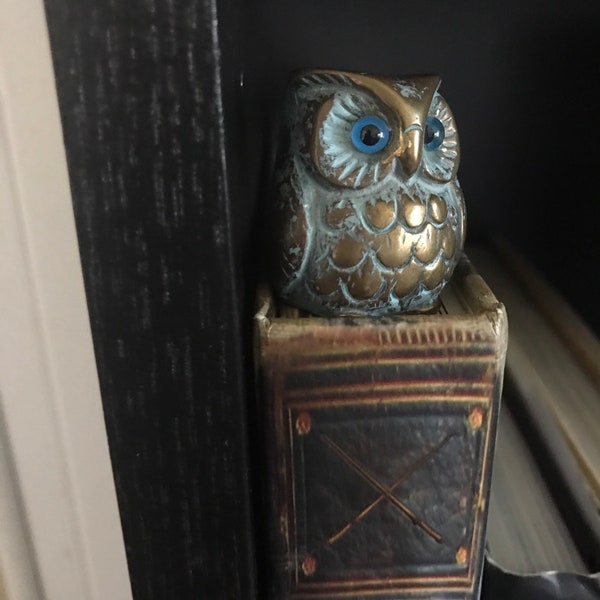 Small patina Brass owl with blue glass eyes