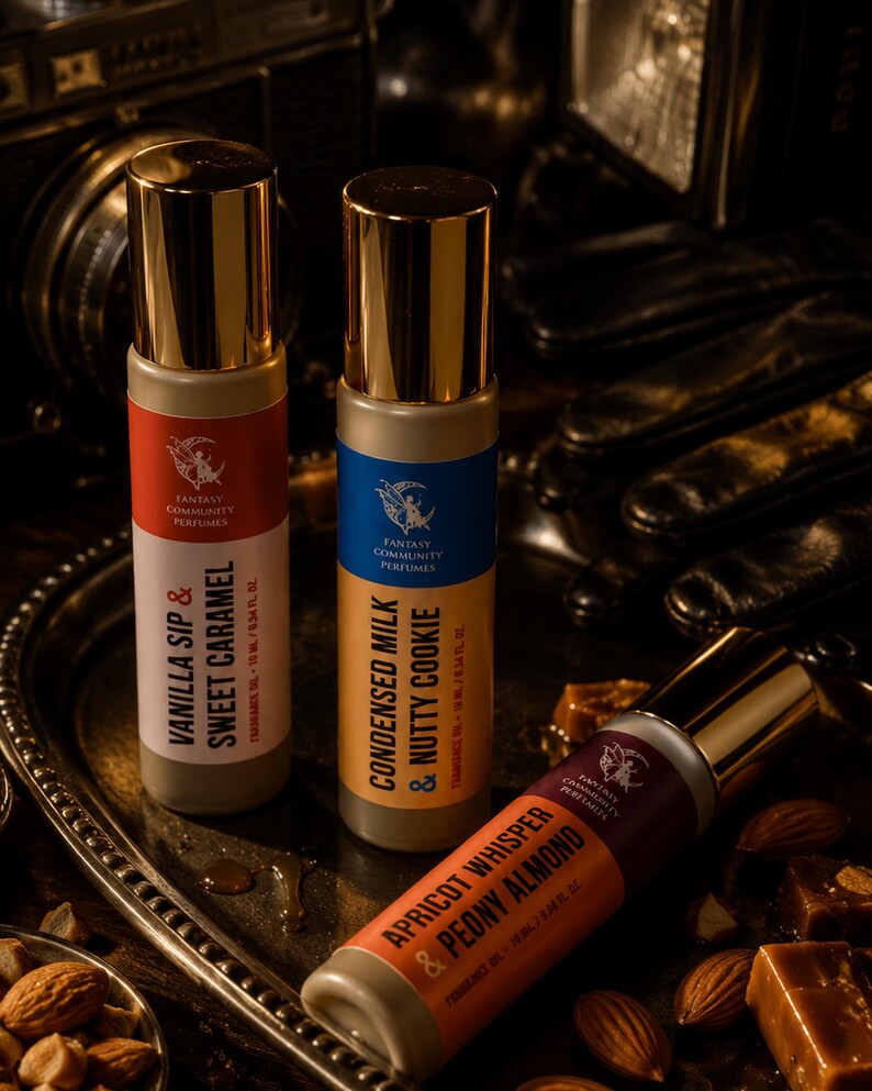 May include: Three perfume bottles with gold caps and labels in red, blue, and orange. The labels read "Vanilla Sip & Sweet Caramel", "Condensed Milk & Nutty Cookie", and "Apricot Whisper & Peony Almond". The bottles are on a silver tray with nuts and candies.
