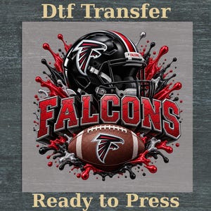 May include: A DTF transfer graphic featuring a black football helmet with a red and white logo, the word FALCONS in bold red letters, and a brown football with a logo, all surrounded by a red and black paint splatter effect on a gray background.