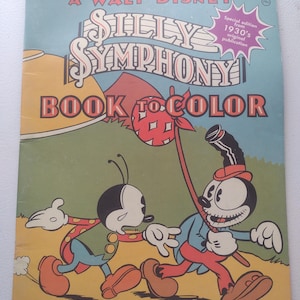 May include: Vintage "Silly Symphony Book to Color" featuring Mickey Mouse characters. The cover displays the title in large letters with a special edition stamp from the 1930s. The illustration shows two cartoon characters in a colorful scene.