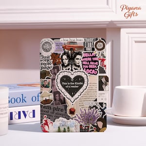May include: A Kindle cover decorated with stickers featuring images and text related to the Twilight saga. The cover includes a heart-shaped sticker that reads "This is the Kindle of a reader."