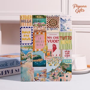 May include: A decorative notebook with a collage design featuring Italian phrases and imagery. The design includes phrases like "Bella," "Dolce Far Niente," and "La Dolce Vita," along with illustrations of food, landscapes, and wine.