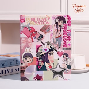 May include: A pink and white notebook with a collage design featuring anime-style illustrations, hearts, and the text "PURE LOVE OPERATION" and "SUPER TRUE LOVE". A silver star and a CD are also visible.