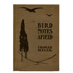 May include: A vintage book cover with the title "BIRD NOTES AFIELD" and the author's name, Charles Keeler. The cover is a tan color with a tree and birds in silhouette. The book is rectangular and has a textured appearance.