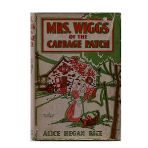 May include: A vintage book cover for "Mrs. Wiggs of the Cabbage Patch" by Alice Hegan Rice. The cover features a cartoon illustration of a woman hanging laundry outside a small brick house with a red roof. The book cover is green and beige with red and white accents.