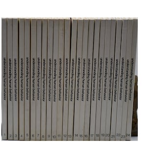 May include: A collection of 24 books titled "Understanding Human Behavior" with white covers and black text. The books are numbered 1 through 24 on their spines and are arranged in a neat row.