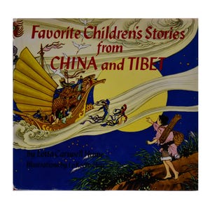 May include: A book cover with a yellow, red, and blue illustration of a ship sailing on a blue sky with a full moon. The title of the book is "Favorite Children's Stories from CHINA and TIBET".