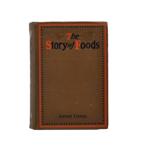 Könnte beinhalten: Ein braunes Buch mit rotem und schwarzem Rand. Der Titel lautet "The Story of Foods" und darunter steht der Autor "Forrest Crissey".