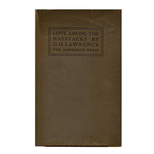 May include: A brown book cover with the title "Love Among the Haystacks - By D.H. Lawrence - The Monasuch Press" printed in black.