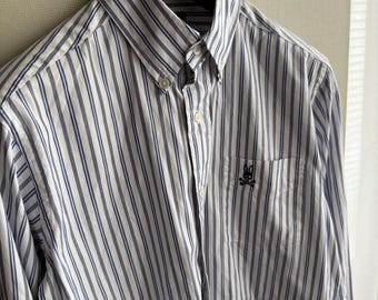 Camisa de rayas azules y blancas de Psycho Bunny de Robert Godley