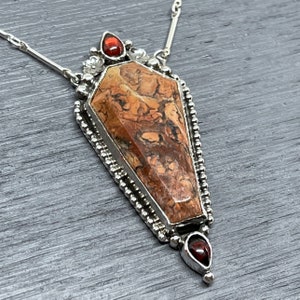 coffin pendant with garnets