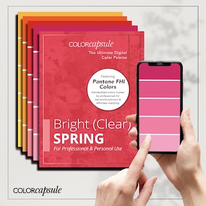 May include: A stack of colour swatches with a red background and the text "COLORCapsule The Ultimate Digital Colour Palette Featuring Pantone FHI Colours Standardized colours trusted by professionals for real-world precision & effortless matching Bright (Clear) SPRING For Professional & Personal Use COLORCapsule" A hand is holding a smartphone displaying a colour palette.