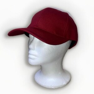 May include: A red baseball cap with a white mesh back.