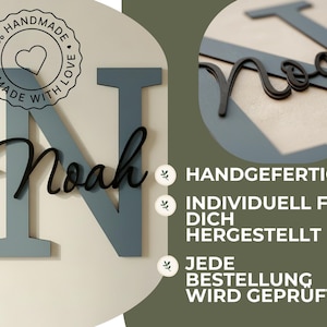 May include: A wooden sign with the name "Noah" in a black script font over a large, light blue letter "N". The sign also features a circular emblem that reads "100% Handmade with Love". The background is a neutral color.