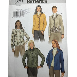 May include: A Butterick sewing pattern envelope, featuring illustrations of women's jackets. The envelope is white with the number "3573" and the brand name "Butterick" printed in black. The jackets are in various colors and styles.